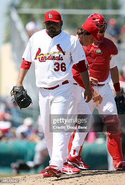 Dennys Reyes of the St Louis Cardinals is relieved by manager Tony La Russa while taking on the Washington Nationals at Roger Dean Stadium on March...