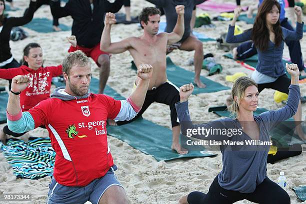 Jarrod Saffy of the Dragons and Annalise Braakensiek join 284 Sydneysiders in the annual free Gumtree Community Yoga Class at Bondi Beach on April 1,...