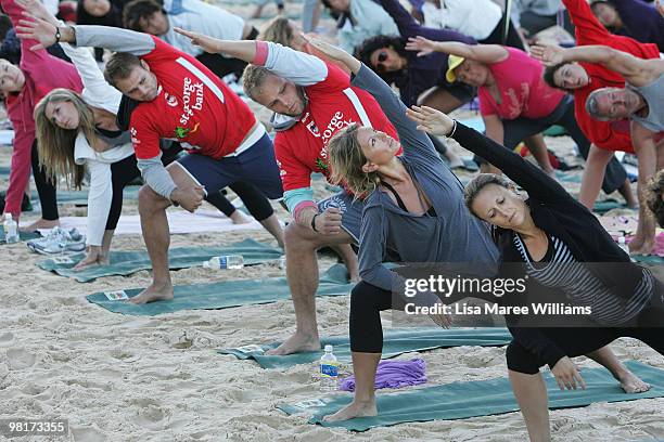 Jason Nightingale and Jarrod Saffy of the Dragons alongside Annalise Braakensiek join 284 Sydneysiders in the annual free Gumtree Community Yoga...