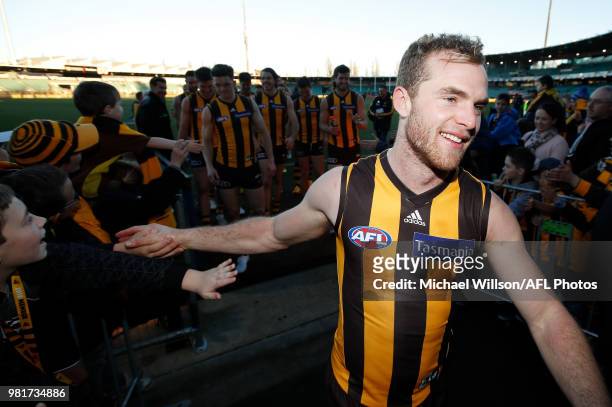 Tom Mitchell of the Hawks celebrates after his 100th match during the 2018 AFL round 14 match between the Hawthorn Hawks and the Gold Coast Suns at...
