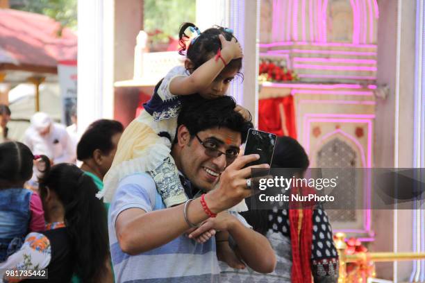 Pilgrims taking selfie during Mela kher bhawani in Ganderbal, some 28 km northeast of Srinagar, on 20 June 2018. Thousands of Hindu devotees attended...