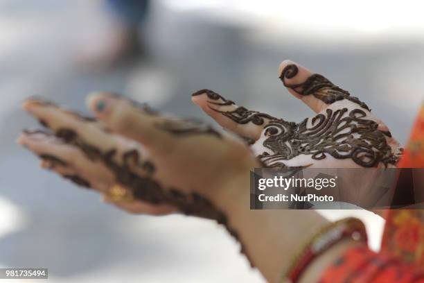 Henna decorated hands of a girl can be seen at Mela Kher bhawani in Ganderbal, some 28 km northeast of Srinagar, on 20 June 2018. Thousands of Hindu...