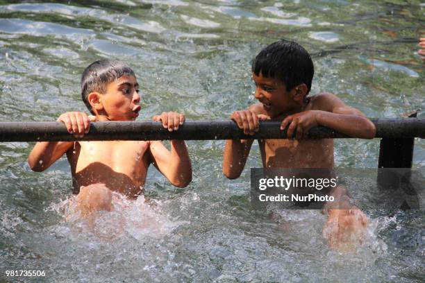 Kids enjoying swimming at Tulmulla during Mela Kher bhawani in Ganderbal, some 28 km northeast of Srinagar, on 20 June 2018. Thousands of Hindu...