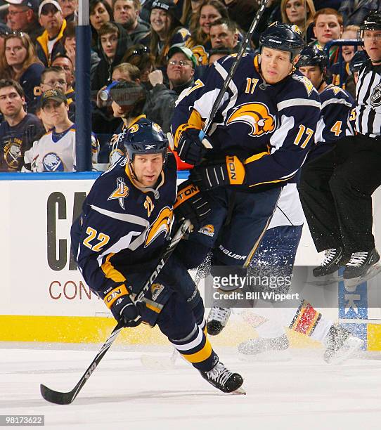 Raffi Torres of the Buffalo Sabres jumps to avoid a collision with teammate Adam Mair during the Buffalo Sabres game against the Florida Panthers on...