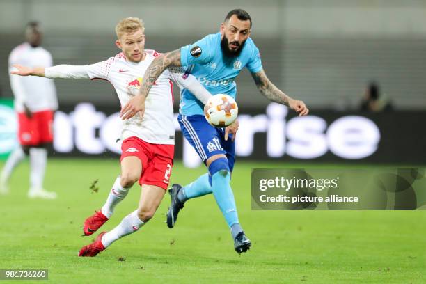 April 2018, Germany, Leipzig: Soccer, Europa League, RB Leipzig vs Olympique Marseille at the Red Bull Arena. Marseille's Konstantinos Mitroglou and...