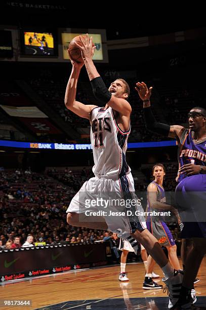 Brook Lopez of the New Jersey Nets shoots against the Phoenix Suns during the game on March 31, 2010 at the Izod Center in East Rutherford, New...
