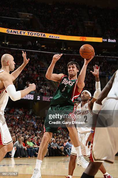 Andrew Bogut of the Milwaukee Bucks shoots after being fouled by Zydrunas Ilgauskas of the Cleveland Cavaliers on March 31, 2010 at Quicken Loans...