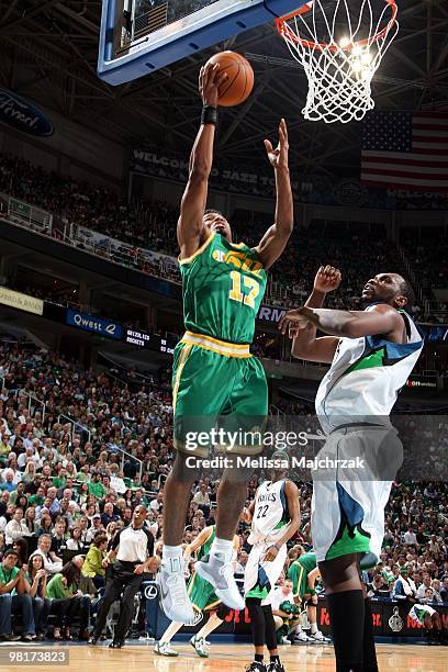 Ronnie Price of the Utah Jazz shoots a layup against Al Jefferson of the Minnesota Timberwolves during the game at the EnergySolutions Arena on March...