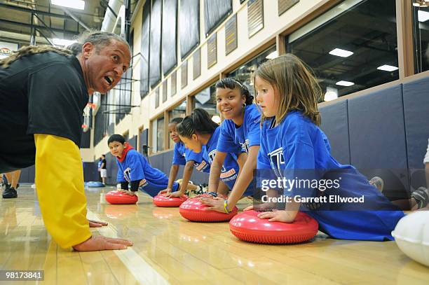 Strength and conditioning coach Steve Hess of the Denver Nuggets instructs children from the Boettcher Boys and Girls Club during a Denver Nuggets...