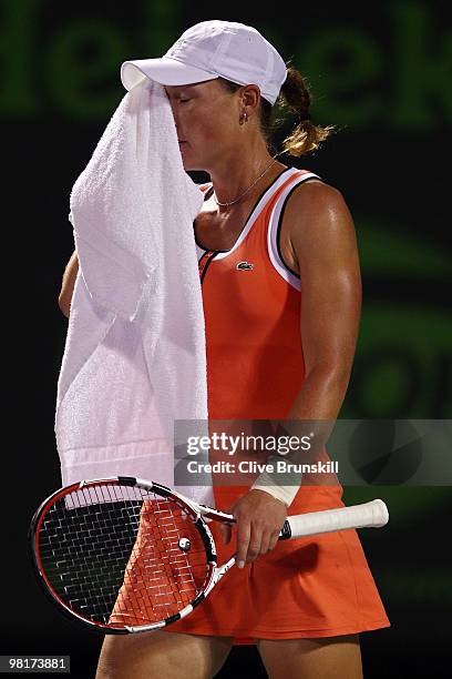 Samantha Stosur of Australia wipes her face while playing against Kim Clijsters of Belgium during day nine of the 2010 Sony Ericsson Open at Crandon...