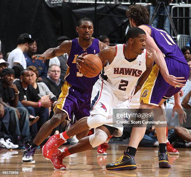 Joe Johnson of the Atlanta Hawks drives against Pau Gasol of the Los Angeles Lakers on March 31, 2010 at Philips Arena in Atlanta, Georgia. NOTE TO...