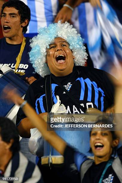 Supporters of Uruguay's Cerro cheer their team before the start of the Libertadores Cup football match against Brazil's Internacional, at Beira Rio...