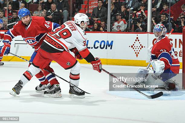 Patrick Dwyer of the Carolina Hurricanes takes a shot on goalie Carey Price of Montreal Canadiens during the NHL game on March 31, 2010 at the Bell...