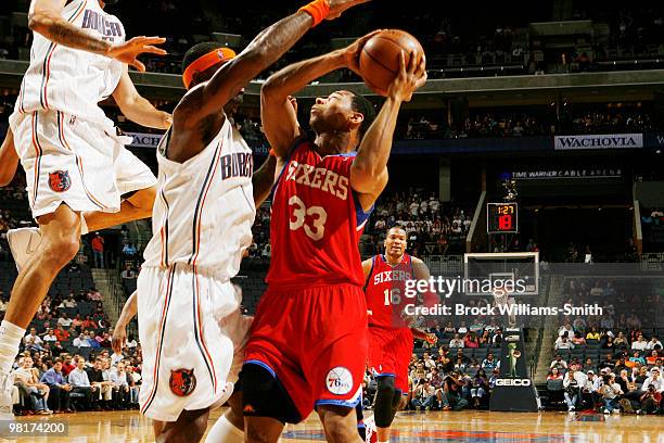 Stephen Jackson of the Charlotte Bobcats guards against Willie Green of the Philadelphia 76ers on March 31, 2010 at the Time Warner Cable Arena in...