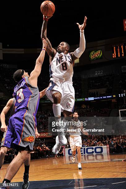 Terrence Williams of the New Jersey Nets shoots against Jared Dudley of the Phoenix Suns during the game on March 31, 2010 at the Izod Center in East...