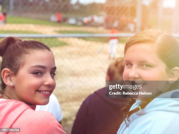 two girls at baseball game - rockford illinois stock pictures, royalty-free photos & images