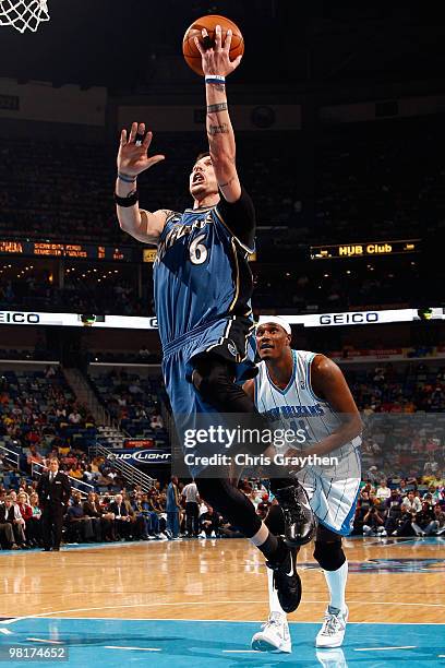 Mike Miller of the Washington Wizards shoots the ball over James Posey of the New Orleans Hornets at New Orleans Arena on March 31, 2010 in New...