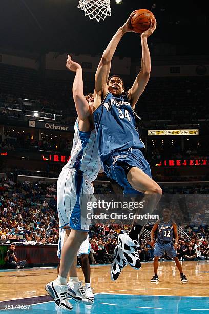 JaVale McGee of the Washington Wizards shoots the ball over Aaron Gray of the New Orleans Hornets at New Orleans Arena on March 31, 2010 in New...