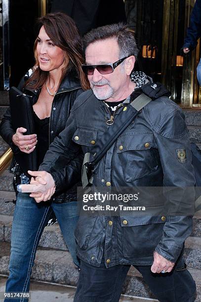 Actor Robin Williams and his companion leave their midtown Manhattan hotel on March 31, 2010 in New York City.