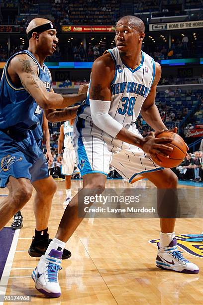 David West of the New Orleans Hornets posts up against James Singleton of the Washington Wizards on March 31, 2010 at the New Orleans Arena in New...