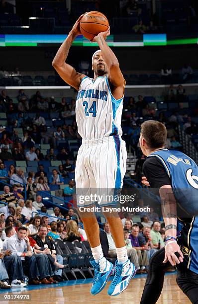 Morris Peterson of the New Orleans Hornets shoots over Mike Miller of the Washington Wizards on March 31, 2010 at the New Orleans Arena in New...