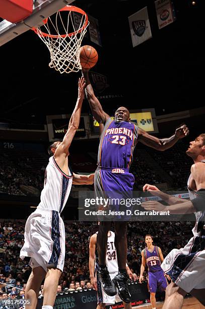 Jason Richardson of the Phoenix Suns shoots against Yi Jianlian of the New Jersey Nets during the game on March 31, 2010 at the Izod Center in East...