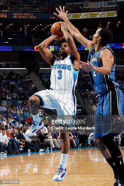 Chris Paul of the New Orleans Hornets shoots against Shaun Livingston of the Washington Wizards on March 31, 2010 at the New Orleans Arena in New...