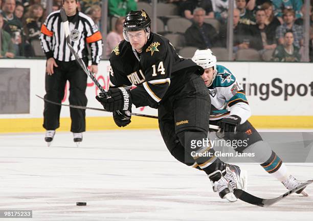 Jamie Benn of the Dallas Stars is chased by Scott Nichol of the San Jose Sharks on March 31, 2010 at the American Airlines Center in Dallas, Texas.