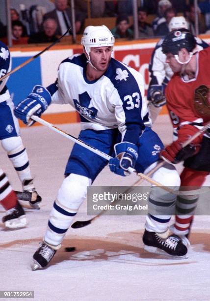 Al Iafrate of the Toronto Maple Leafs skates against the Chicago Black Hawks during NHL game action on March 19, 1990 at Maple Leaf Gardens in...