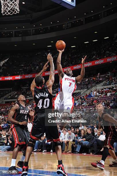 Ben Gordon of the Detroit Pistons goes up for a shot against Udonis Haslem of the Miami Heat in a game at the Palace of Auburn Hills on March 31,...