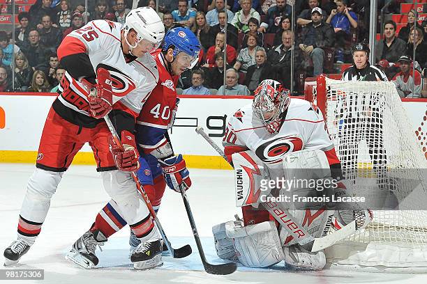 Maxim Lapierre of Montreal Canadiens takes a shot on goalie Cam Ward of the Carolina Hurricanes during the NHL game on March 31, 2010 at the Bell...