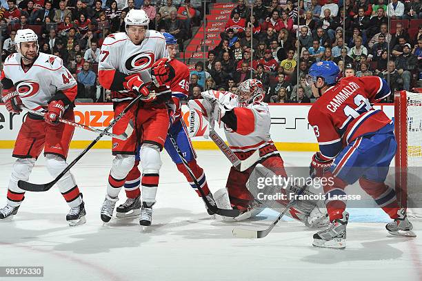 Cam Ward of the Carolina Hurricanes blocks a shot of Andrei Kostitsyn of Montreal Canadiens during the NHL game on March 31, 2010 at the Bell Center...