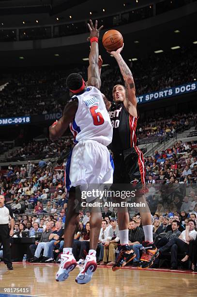 Michael Beasley of the Miami Heat has his shot blocked by Ben Wallace of the Detroit Pistons in a game at the Palace of Auburn Hills on March 31,...