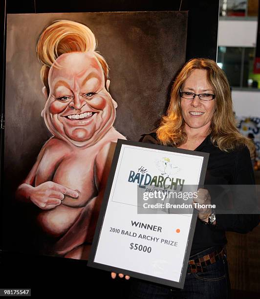 Judy Nadin poses with her award-winning portrait "Patti's Cake" of Bert Newton at the announcement of the 2010 Bald Archy Prize on April 1, 2010 in...
