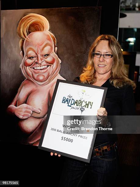 Judy Nadin poses with her award-winning portrait "Patti's Cake" of Bert Newton at the announcement of the 2010 Bald Archy Prize on April 1, 2010 in...