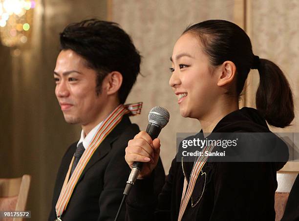 Daisuke Takahashi and Mao Asada attend a press conference after winning gold medals at ISU World Figure Skating Championships at a Tokyo hotel on...