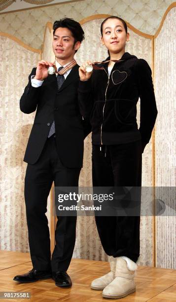 Daisuke Takahashi and Mao Asada attend a press conference after winning gold medals at ISU World Figure Skating Championships at a Tokyo hotel on...