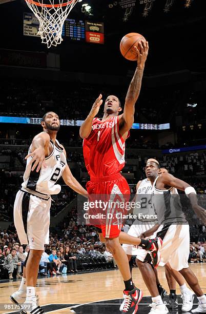 Trevor Ariza of the Houston Rockets shoots against Tim Duncan of the San Antonio Spurs on March 31, 2010 at the AT&T Center in San Antonio, Texas....