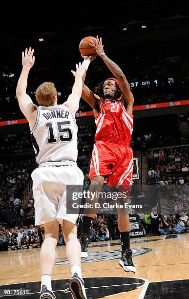 Jordan Hill of the Houston Rockets shoots over Matt Bonner of the San Antonio Spurs on March 31, 2010 at the AT&T Center in San Antonio, Texas. NOTE...