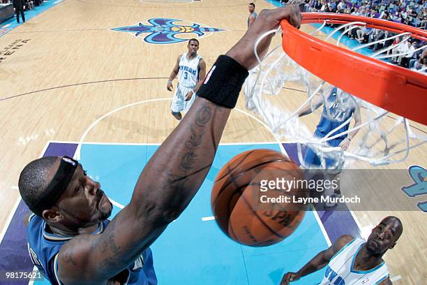 Andray Blatche of the Washington Wizards shoots over Emeka Okafor of the New Orleans Hornets on March 31, 2010 at the New Orleans Arena in New...