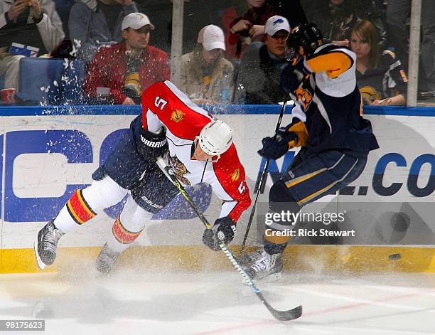 Bryan Allen of the Florida Panthers loses a skate edge on a play against Drew Stafford of the Buffalo Sabres at HSBC Arena on March 31, 2010 in...