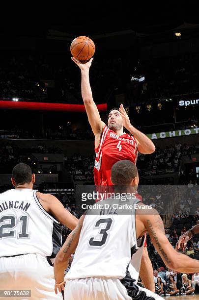 Luis Scola of the Houston Rockets shoots against Tim Duncan and George Hill of the San Antonio Spurs on March 31, 2010 at the AT&T Center in San...