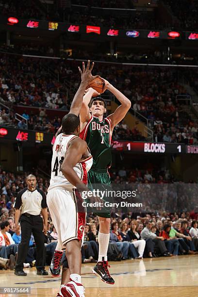 Ersan Ilyasova of the Milwaukee Bucks shoots over Leon Powe of the Cleveland Cavaliers on March 31, 2010 at Quicken Loans Arena in Cleveland, Ohio....