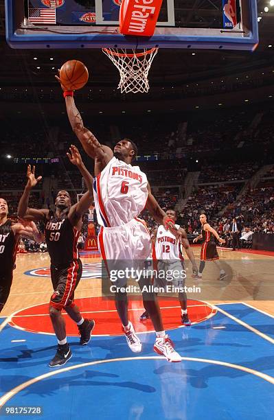 Ben Wallace of the Detroit Pistons goes up for a rebound against Joel Anthony of the Miami Heat in a game at the Palace of Auburn Hills on March 31,...