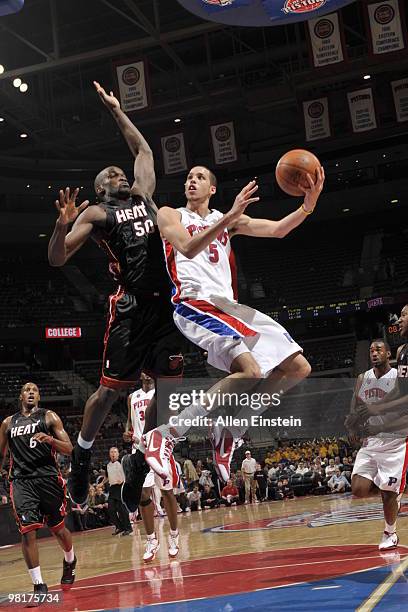 Austin Daye of the Detroit Pistons goes up for a shot against Joel Anthony of the Miami Heat in a game at the Palace of Auburn Hills on March 31,...