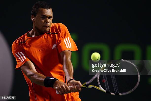 Jo-Wilfried Tsonga of France returns a shot against Rafael Nadal of Spain during day nine of the 2010 Sony Ericsson Open at Crandon Park Tennis...