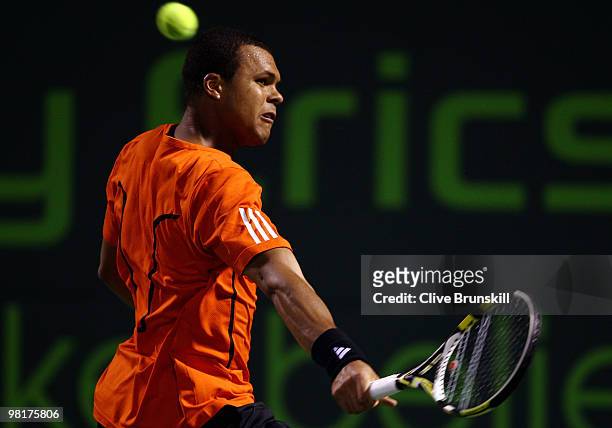 Jo-Wilfried Tsonga of France returns a shot against Rafael Nadal of Spain during day nine of the 2010 Sony Ericsson Open at Crandon Park Tennis...
