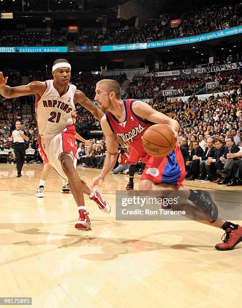 Steve Blake of the Los Angeles Clippers makes his move along the baseline next to Antoine Wright of the Toronto Raptors during a game on March 31,...