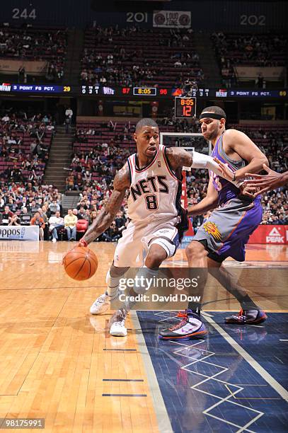 Terrence Williams of the New Jersey Nets drives against Jared Dudley of the Phoenix Suns during the game on March 31, 2010 at the Izod Center in East...