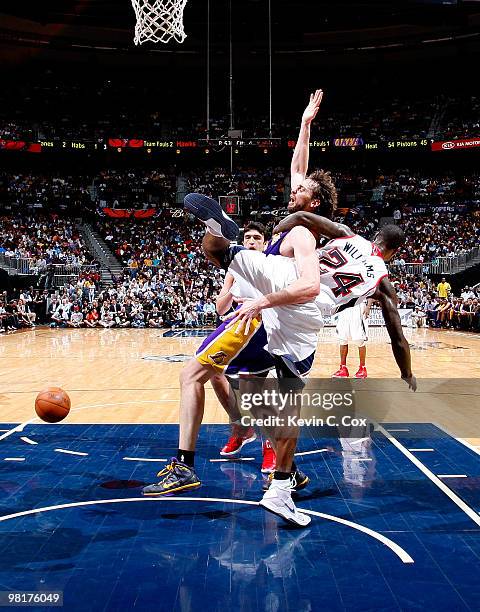 Marvin Williams of the Atlanta Hawks fouls Pau Gasol of the Los Angeles Lakers at Philips Arena on March 31, 2010 in Atlanta, Georgia. NOTE TO USER:...